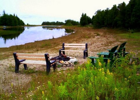 The view of the shoreline fire-pit showing the benches. Complimentary fire-wood is provided.